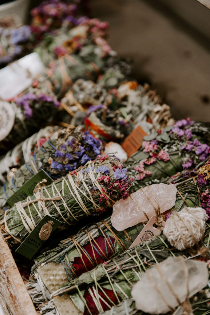 Sage wrapped with colorful flowers and crystals