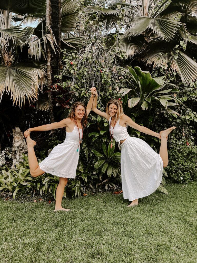 Two girls doing yoga after becoming a certified yoga instructor